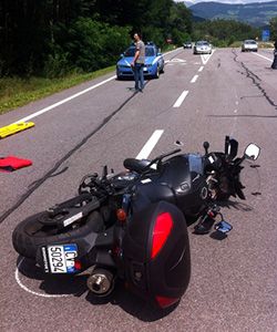 A motorcycle lies on the road after an accident