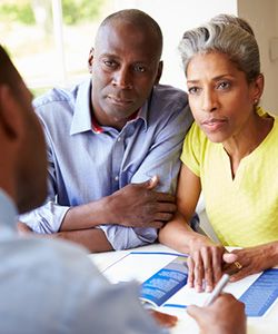 A couple discuss their insurance plan